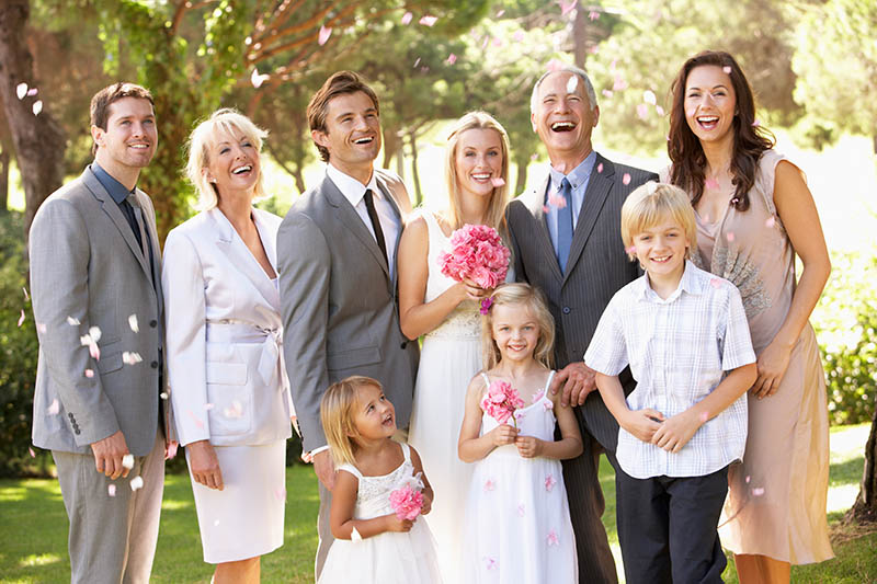 Family at wedding with white teeth